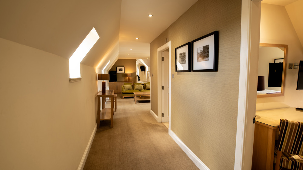 Signature suite hallway with the living area visible.