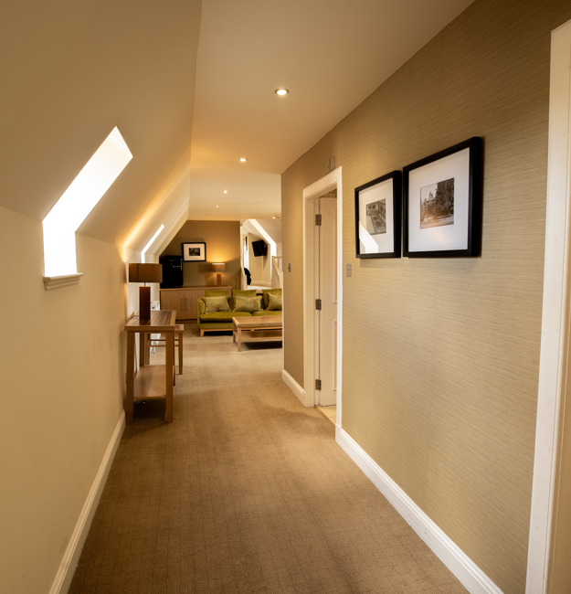 Signature suite hallway with the living area visible.