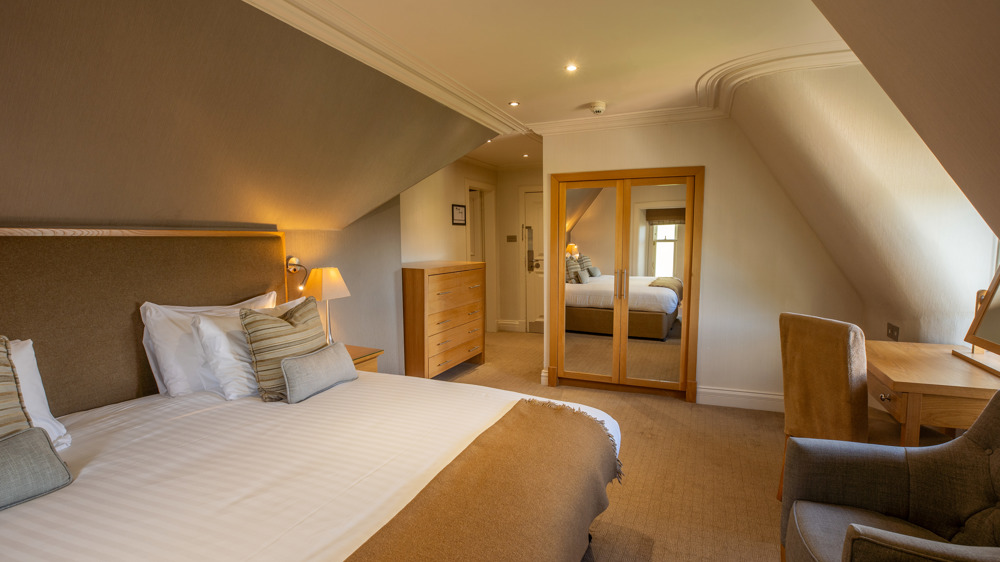 Family apartment with king sized bed in its own sleeping area.