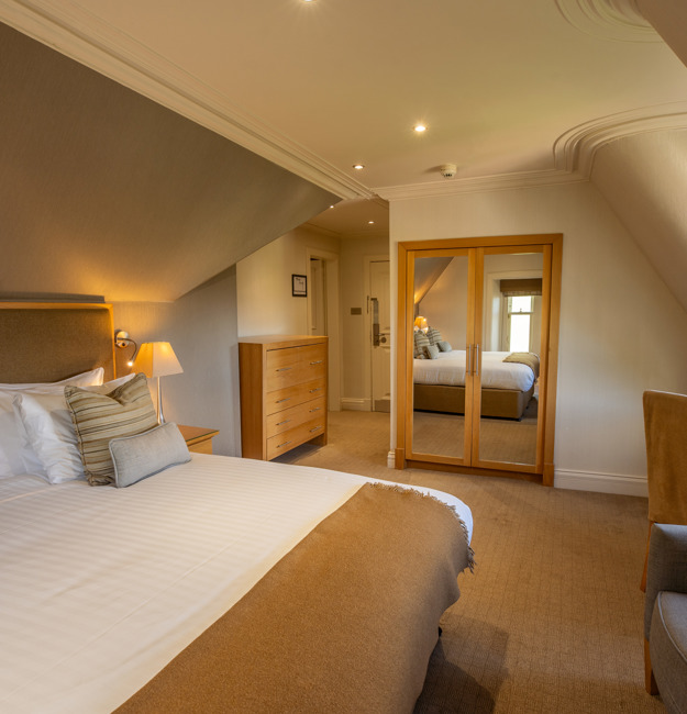 Family apartment with king sized bed in its own sleeping area.