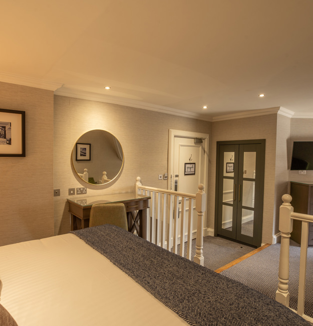 Family apartment with king-sized bed in a semi-gated area. You can see the other sleeping area in the background.